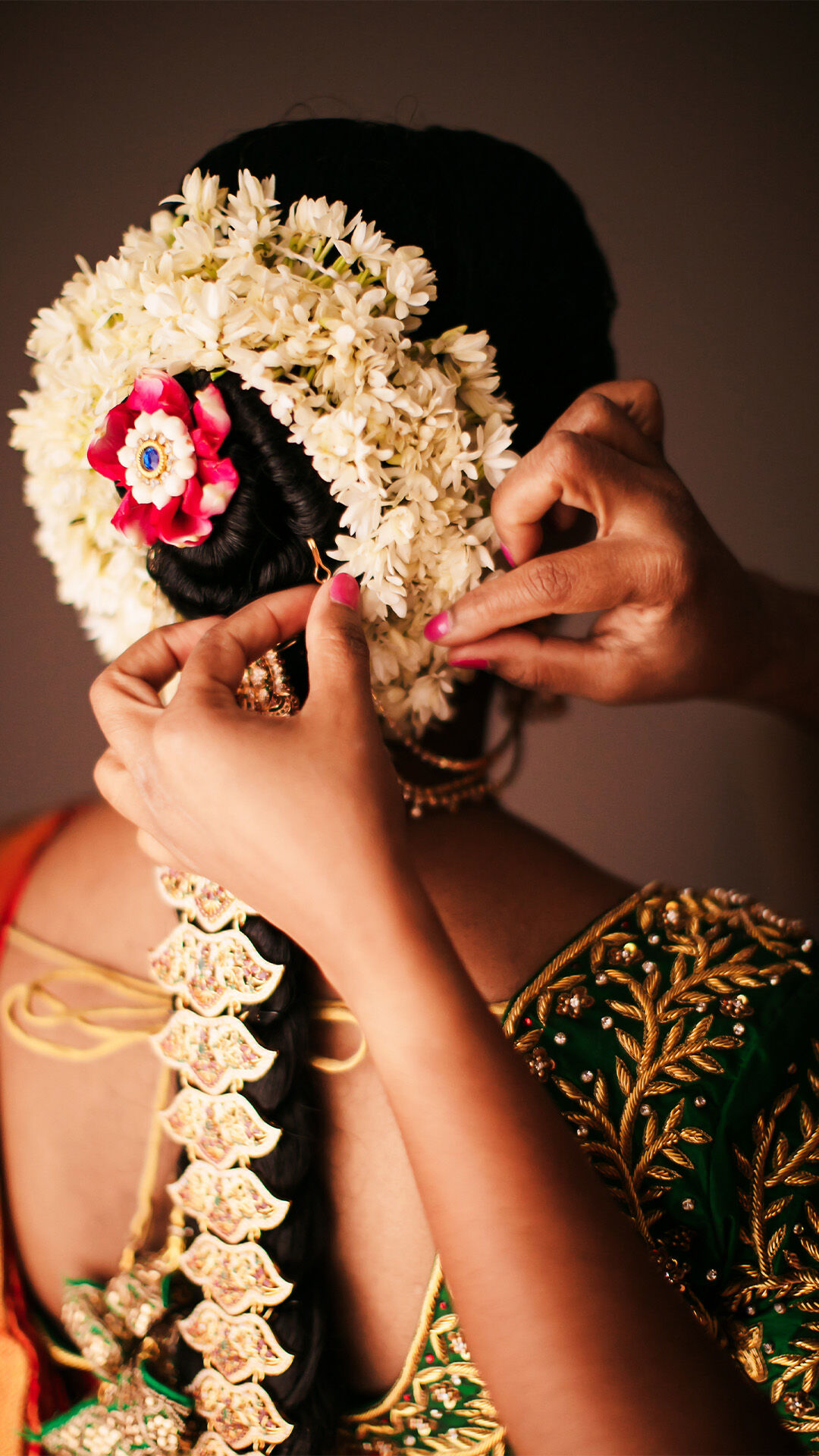 Bride having stylist hairstyle with gajra on her hair